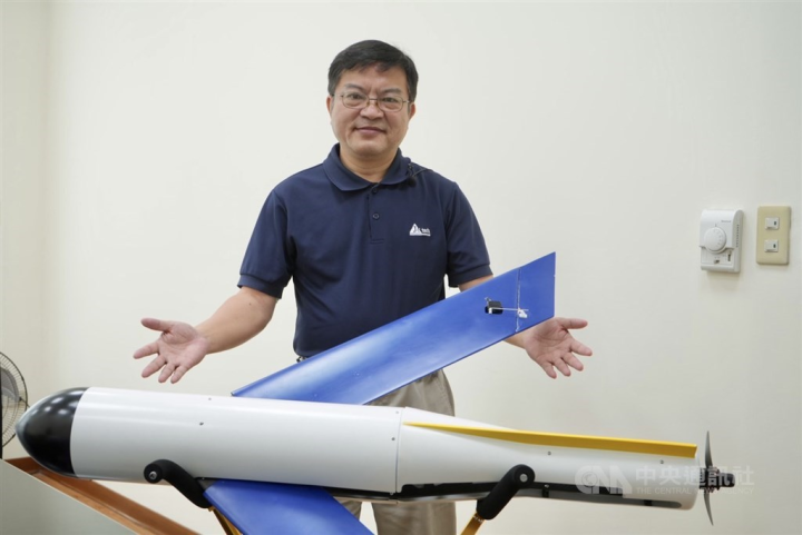 JC Tech General Manager Robert Cheng poses with a Flyingfish 200 suicide drone in Taipei. CNA photo Sept. 10, 2022
