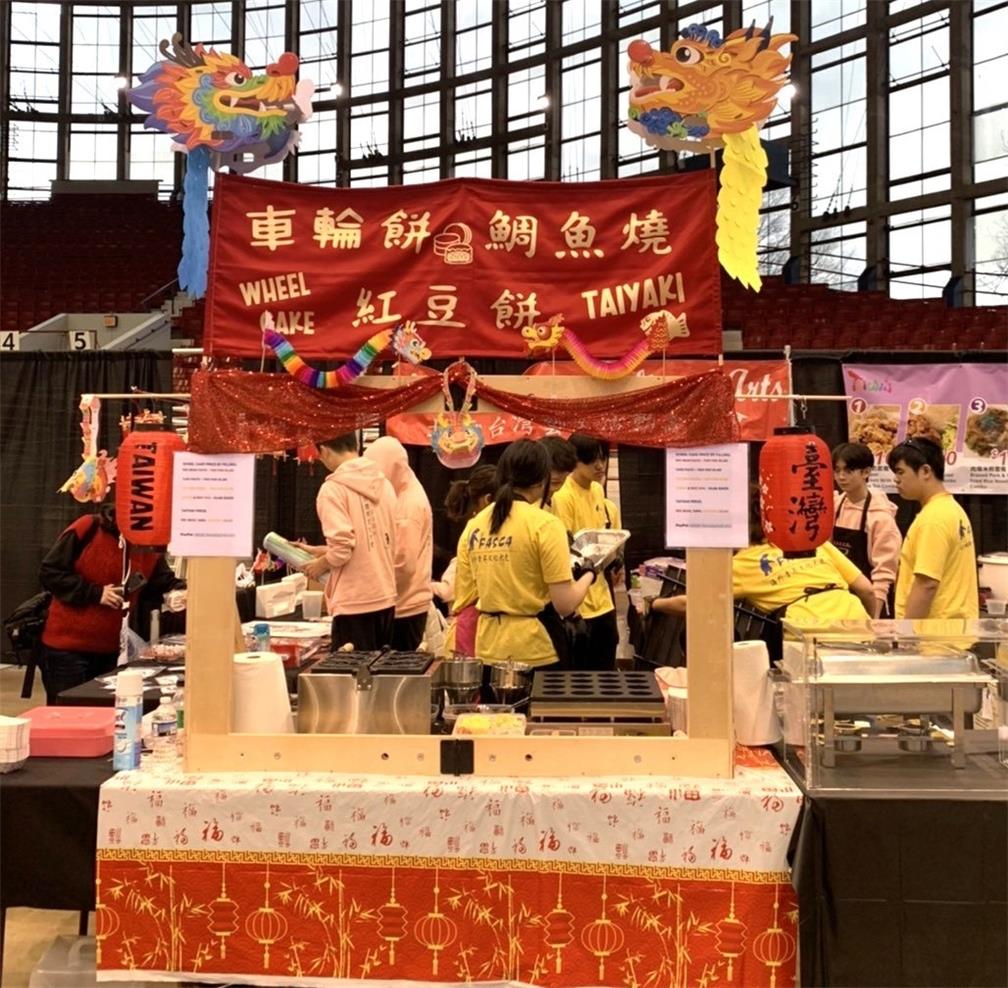 Members of FASCA-Raleigh are making Taiwanese wheel cakes at the cultural booth.