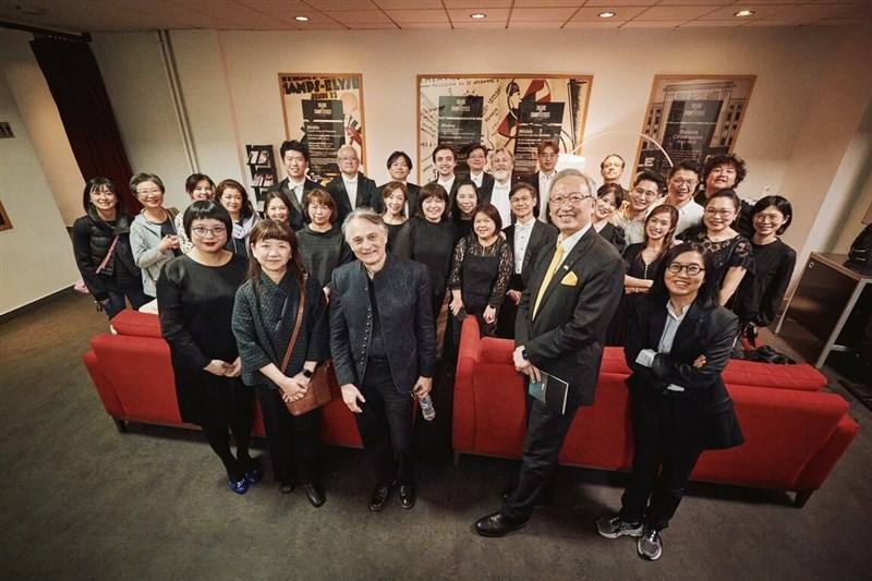 NSO Music Director Jun Märkl (front row, third left) and orchestra members are pictured with Taiwan's representative in France François Wu (front row, second right) and Deputy Culture Minister Lee Ching-hwi (front row, second left) at the backstage of the